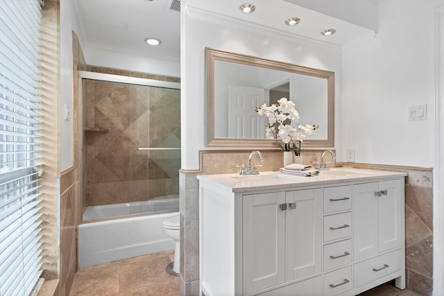 6104 Bluff Point Dr, Dallas, TX 75248 - bathroom with crown molding, tile walls, double vanity, enclosed tub / shower combo, and tile patterned floors