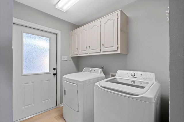 6104 Bluff Point Dr, Dallas, TX 75248 - laundry area with washer and dryer, cabinet space, and light wood-type flooring