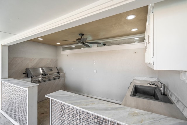 6104 Bluff Point Dr, Dallas, TX 75248 - kitchen featuring white cabinetry, recessed lighting, a ceiling fan, and light stone counters