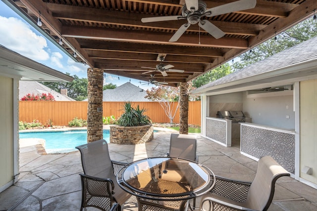 6104 Bluff Point Dr, Dallas, TX 75248 - fenced backyard featuring exterior kitchen, outdoor dining space, a ceiling fan, and a patio area