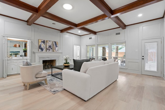 6104 Bluff Point Dr, Dallas, TX 75248 - living room with a decorative wall, beam ceiling, light wood-style flooring, coffered ceiling, and a premium fireplace