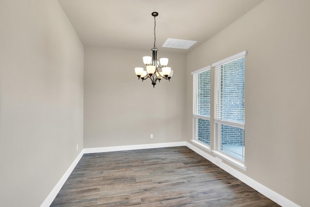 350 Windsor St, Waxahachie, TX 75165 - empty room with a chandelier, healthy amount of natural light, and wood finished floors