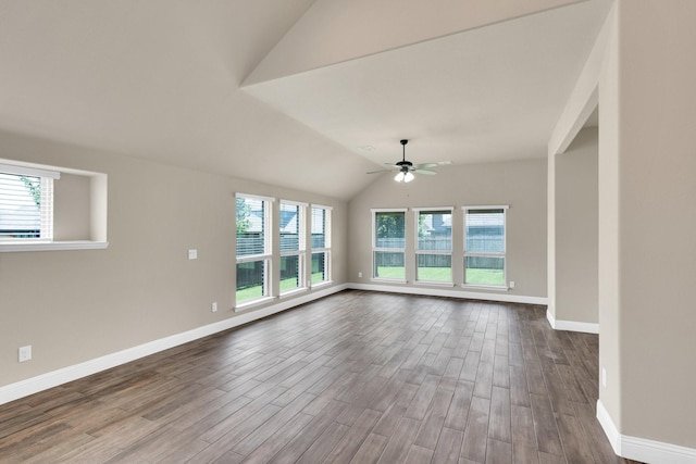 350 Windsor St, Waxahachie, TX 75165 - unfurnished living room featuring vaulted ceiling, dark wood-style floors, and ceiling fan