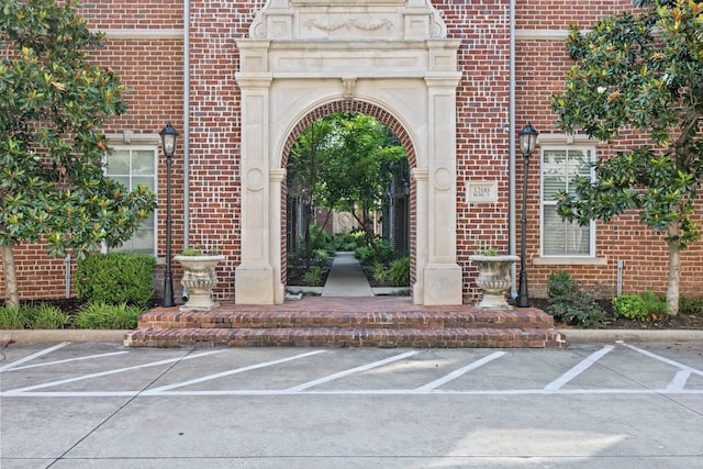 3200 Ross Ave Unit 22, Dallas, TX 75204 - doorway to property featuring brick siding and uncovered parking