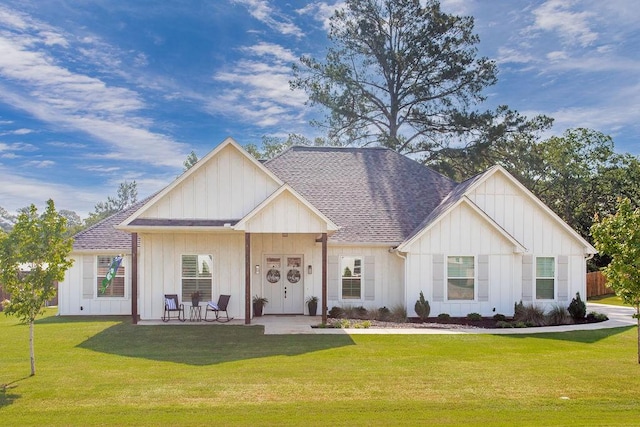 14423 Woodland Crk, Tyler, TX 75706 - modern farmhouse style home with board and batten siding, a front lawn, and roof with shingles
