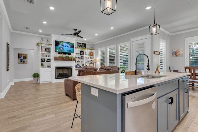 14423 Woodland Crk, Tyler, TX 75706 - kitchen with dishwasher, gray cabinetry, ceiling fan, crown molding, and light wood-type flooring
