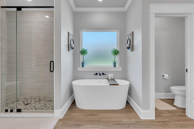14423 Woodland Crk, Tyler, TX 75706 - full bath with a soaking tub, a stall shower, ornamental molding, and wood finished floors