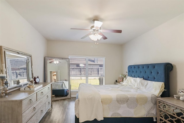 1117 Lake Woodland Dr, Little Elm, TX 75068 - bedroom with dark wood-style flooring and a ceiling fan