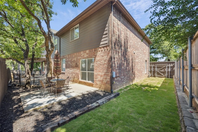 3403 Brighton Ct, Highland Village, TX 75077 - back of house with brick siding, a fenced backyard, and a patio area