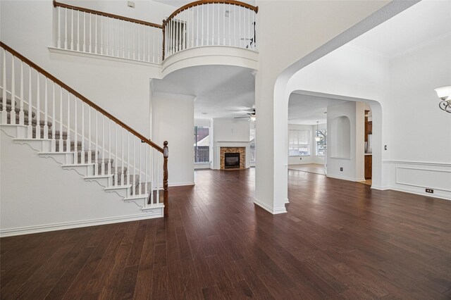 3403 Brighton Ct, Highland Village, TX 75077 - foyer with a towering ceiling, a ceiling fan, stairway, ornamental molding, and wood finished floors