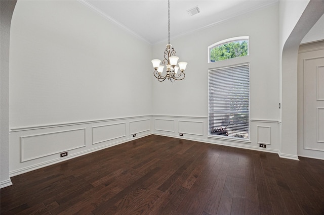 3403 Brighton Ct, Highland Village, TX 75077 - unfurnished dining area with dark wood-style floors, a chandelier, crown molding, arched walkways, and a wainscoted wall