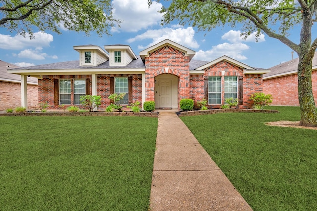 113 Cayman Dr, Lancaster, TX 75146 - view of front of house featuring brick siding, a front yard, and a shingled roof