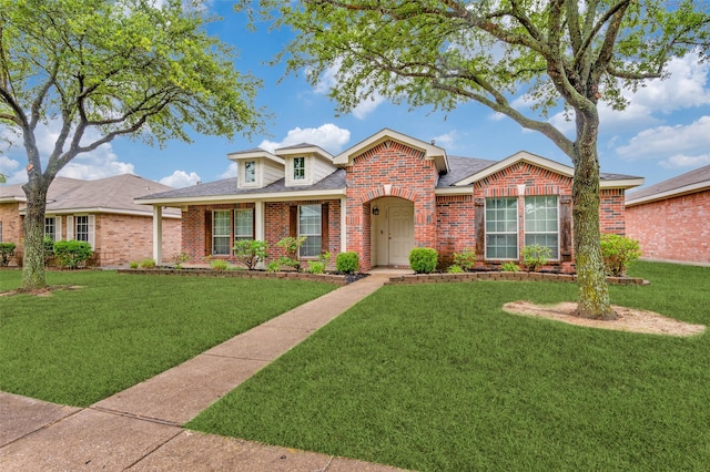 113 Cayman Dr, Lancaster, TX 75146 - traditional-style house with brick siding, a front yard, and a shingled roof