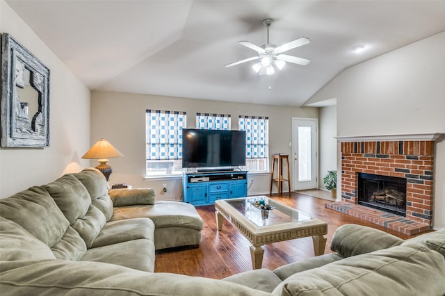 113 Cayman Dr, Lancaster, TX 75146 - living area featuring vaulted ceiling, dark wood finished floors, a ceiling fan, and a fireplace