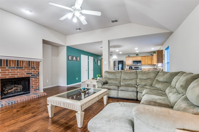 113 Cayman Dr, Lancaster, TX 75146 - living room with wood finished floors, ceiling fan, vaulted ceiling, and a fireplace
