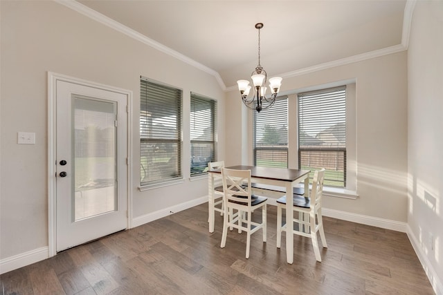 629 Dean Box Dr, Waxahachie, TX 75165 - dining space with crown molding, wood finished floors, and a chandelier