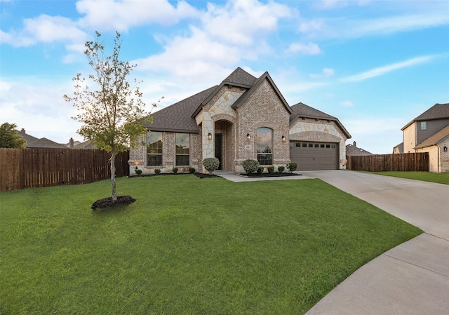 629 Dean Box Dr, Waxahachie, TX 75165 - french country home featuring stone siding, driveway, a garage, roof with shingles, and brick siding