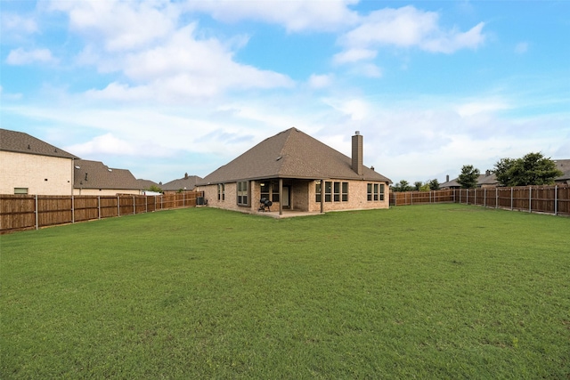 629 Dean Box Dr, Waxahachie, TX 75165 - rear view of house featuring a chimney, a fenced backyard, a patio area, and brick siding