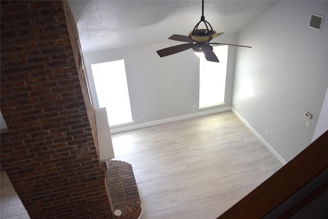 803 Ashmount Ln, Arlington, TX 76017 - detailed view of ceiling fan, a textured ceiling, and wood finished floors