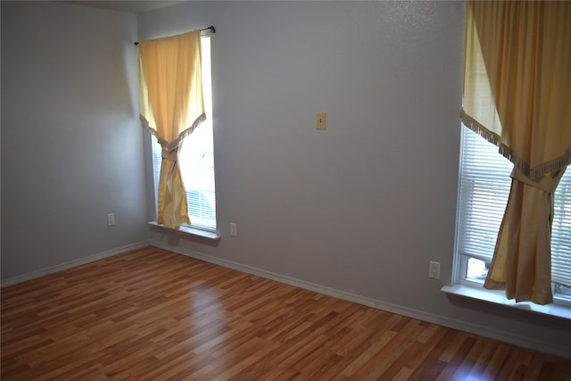 803 Ashmount Ln, Arlington, TX 76017 - empty room with wood finished floors