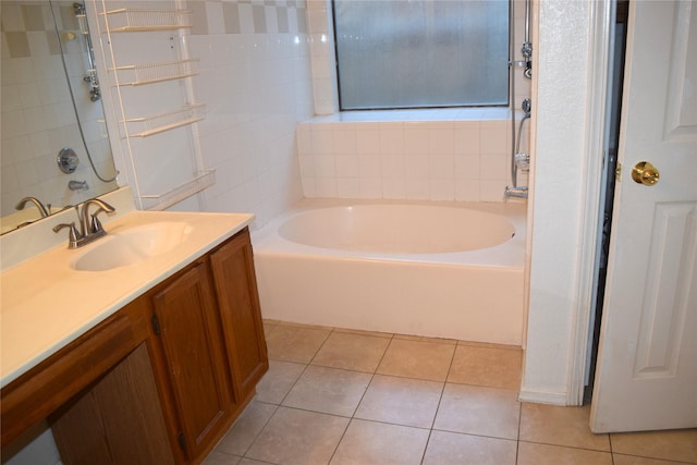 803 Ashmount Ln, Arlington, TX 76017 - bathroom with a garden tub, vanity, and tile patterned floors