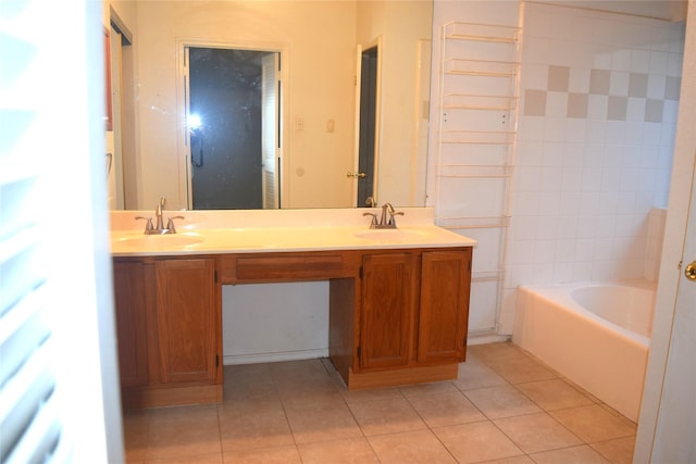 803 Ashmount Ln, Arlington, TX 76017 - bathroom featuring tile patterned floors, double vanity, and a bath