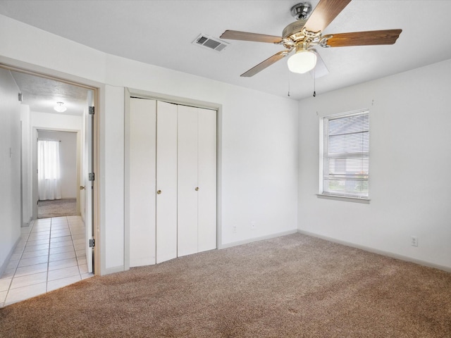 1704 Charlottesville Dr, Ennis, TX 75119 - unfurnished bedroom with light carpet, a closet, and ceiling fan