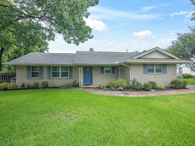1704 Charlottesville Dr, Ennis, TX 75119 - ranch-style house with brick siding, a shingled roof, and a chimney