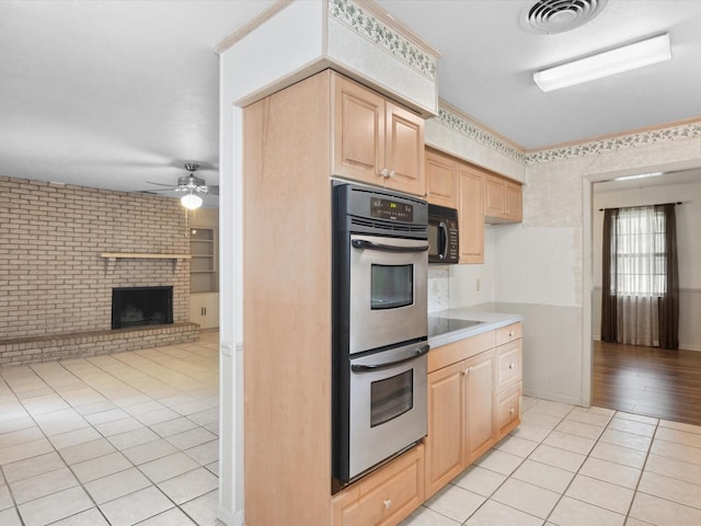1704 Charlottesville Dr, Ennis, TX 75119 - kitchen featuring black appliances, light brown cabinets, ceiling fan, light tile patterned floors, and open floor plan