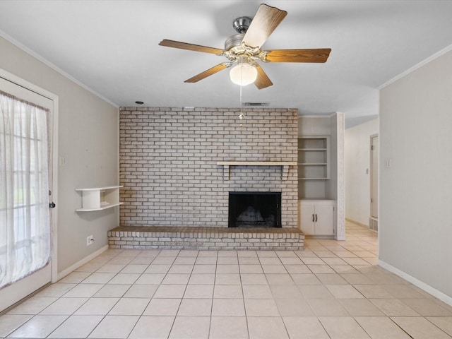 1704 Charlottesville Dr, Ennis, TX 75119 - unfurnished living room with crown molding, light tile patterned floors, a brick fireplace, a ceiling fan, and built in shelves