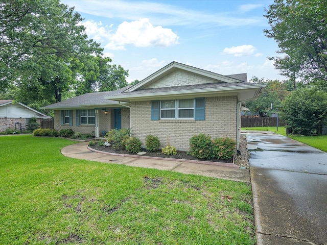 1704 Charlottesville Dr, Ennis, TX 75119 - view of front facade featuring driveway, brick siding, and a shingled roof