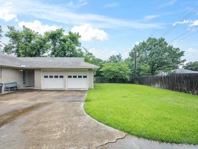 1704 Charlottesville Dr, Ennis, TX 75119 - view of yard featuring concrete driveway and an attached garage