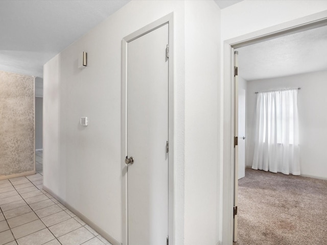 1704 Charlottesville Dr, Ennis, TX 75119 - hallway with baseboards and light tile patterned floors