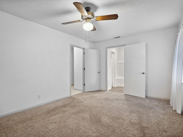 1704 Charlottesville Dr, Ennis, TX 75119 - unfurnished bedroom with light carpet, ensuite bathroom, and ceiling fan