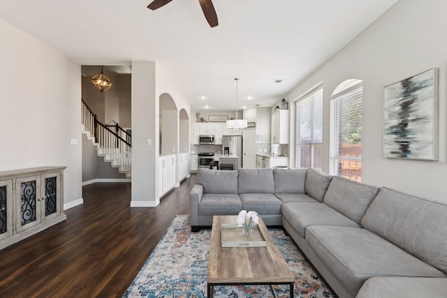 1467 Bent Tree, Frisco, TX 75036 - living room featuring dark wood-style flooring, stairs, a ceiling fan, arched walkways, and recessed lighting