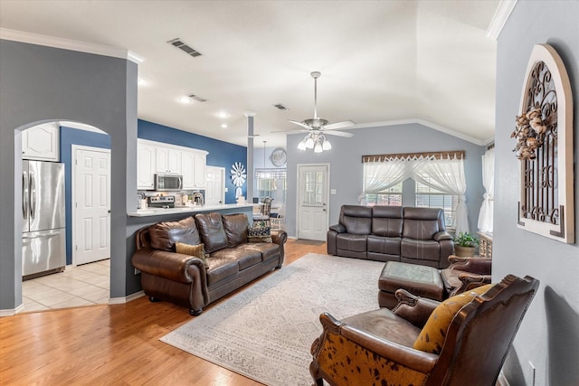 152 Guadalupe Dr, Gun Barrel City, TX 75156 - living room with ceiling fan, crown molding, arched walkways, light wood finished floors, and lofted ceiling