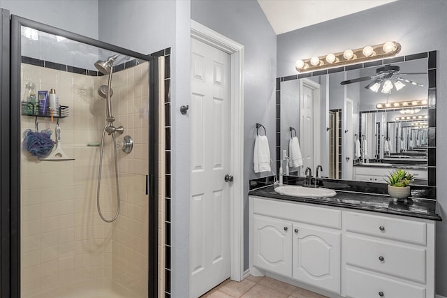 152 Guadalupe Dr, Gun Barrel City, TX 75156 - full bath featuring a stall shower, vanity, ceiling fan, and tile patterned flooring