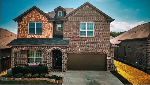 3812 Gennaker Dr, Denton, TX 76210 - view of front of house with brick siding, an attached garage, driveway, and roof with shingles