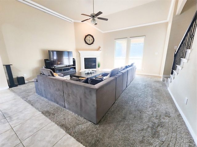 3812 Gennaker Dr, Denton, TX 76210 - living area featuring ceiling fan, ornamental molding, stairs, lofted ceiling, and a glass covered fireplace