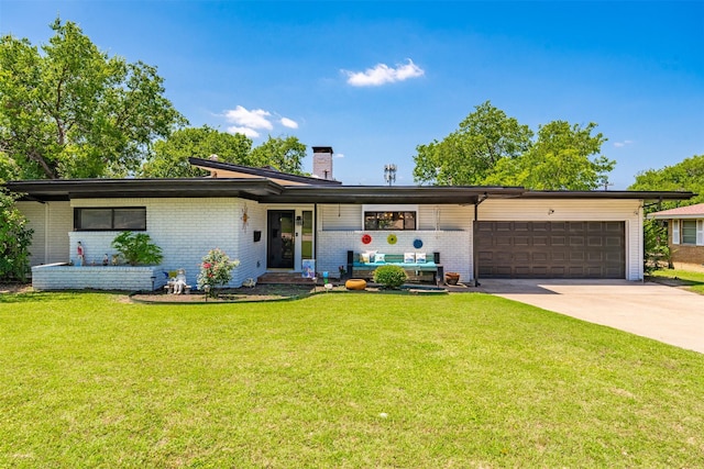 4925 Terrace Trl, Fort Worth, TX 76114 - view of front of home featuring a chimney, brick siding, a garage, concrete driveway, and a front lawn