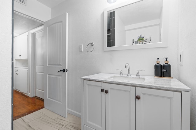 4925 Terrace Trl, Fort Worth, TX 76114 - bathroom with vanity and marble look tiles