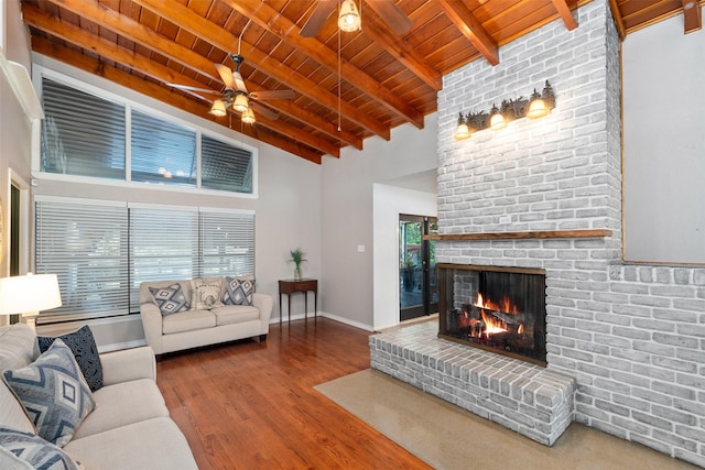4925 Terrace Trl, Fort Worth, TX 76114 - living room with a wood ceiling with exposed beams, a fireplace, a ceiling fan, wood finished floors, and high vaulted ceiling