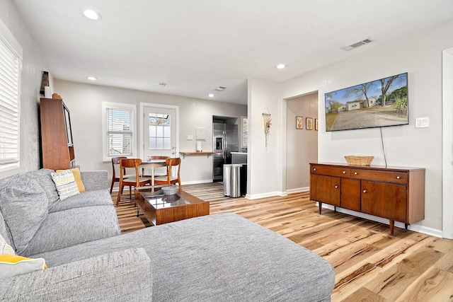 1725 Engle Ave, Dallas, TX 75224 - living area with light wood-style floors and recessed lighting