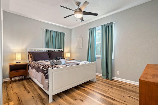 1725 Engle Ave, Dallas, TX 75224 - bedroom with light wood-style floors and ceiling fan