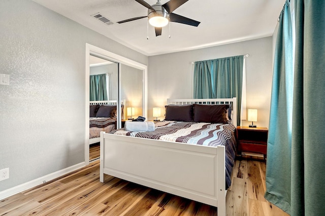 1725 Engle Ave, Dallas, TX 75224 - bedroom featuring wood finished floors, a closet, and a ceiling fan