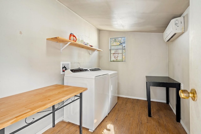1725 Engle Ave, Dallas, TX 75224 - laundry room with a wall mounted air conditioner, light wood finished floors, and washer and dryer