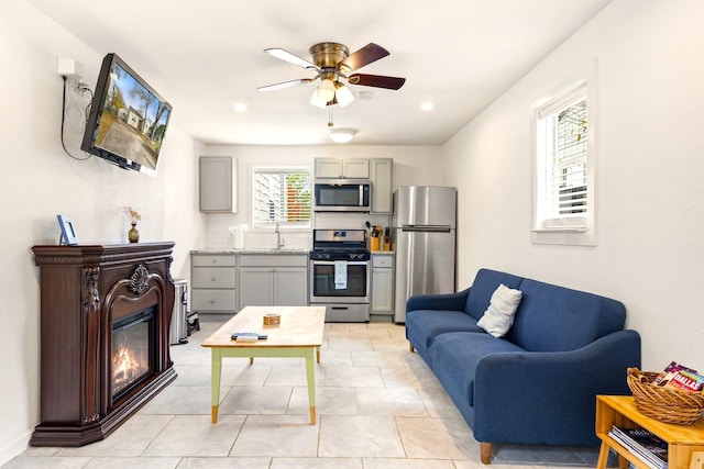 1725 Engle Ave, Dallas, TX 75224 - living room with a ceiling fan and a glass covered fireplace