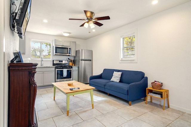 1725 Engle Ave, Dallas, TX 75224 - living area featuring a ceiling fan, recessed lighting, and light tile patterned flooring