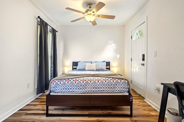1725 Engle Ave, Dallas, TX 75224 - bedroom featuring multiple windows, wood finished floors, and a ceiling fan