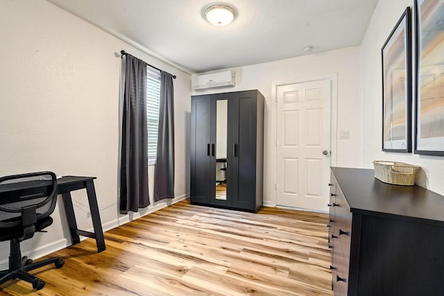 1725 Engle Ave, Dallas, TX 75224 - office space with a wall unit AC and light wood-style flooring